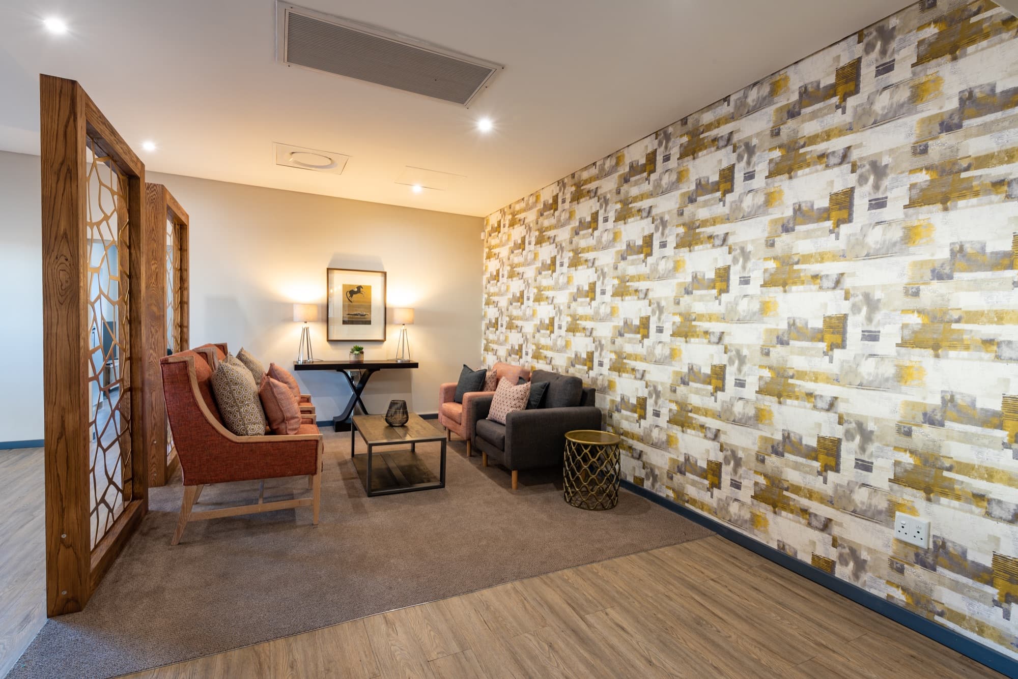 The Lanseria Advantage Lounge with its stone feature wall and lounge seating