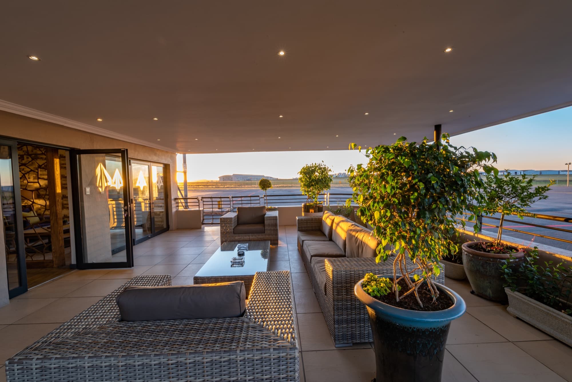 The outdoor terrace of the Lanseria Advantage Lounge at dusk